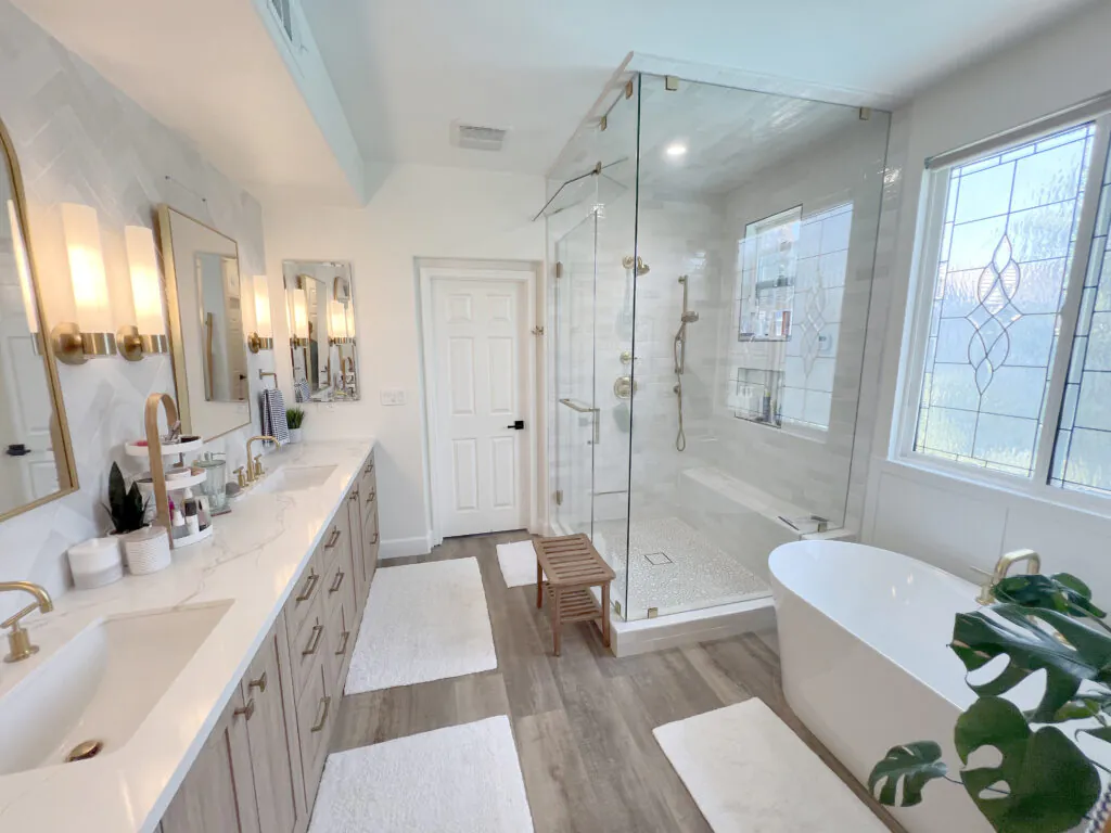Orange County bathroom remodel with a freestanding tub, frameless glass shower and double vanity