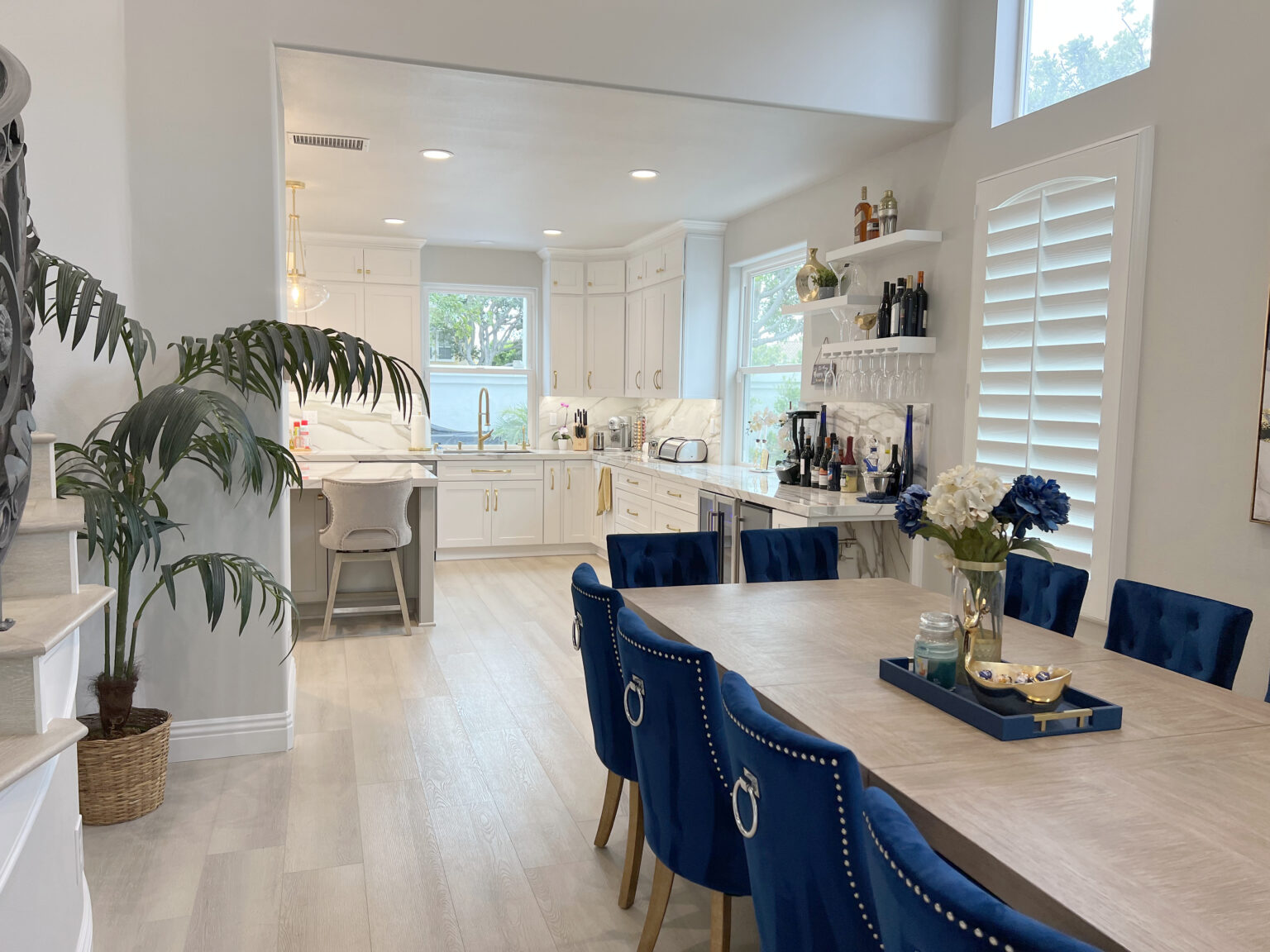 Open-plan kitchen and dining room remodelled by All OC Kitchen & Bath
